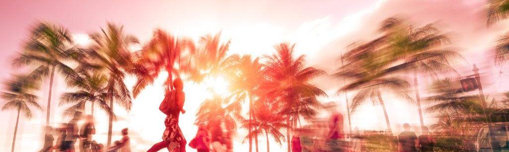 California palm trees and people outside