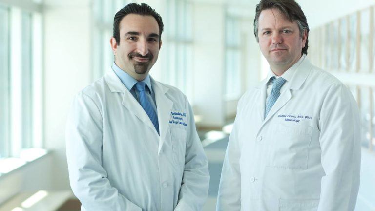 two pni doctors together in a hallway