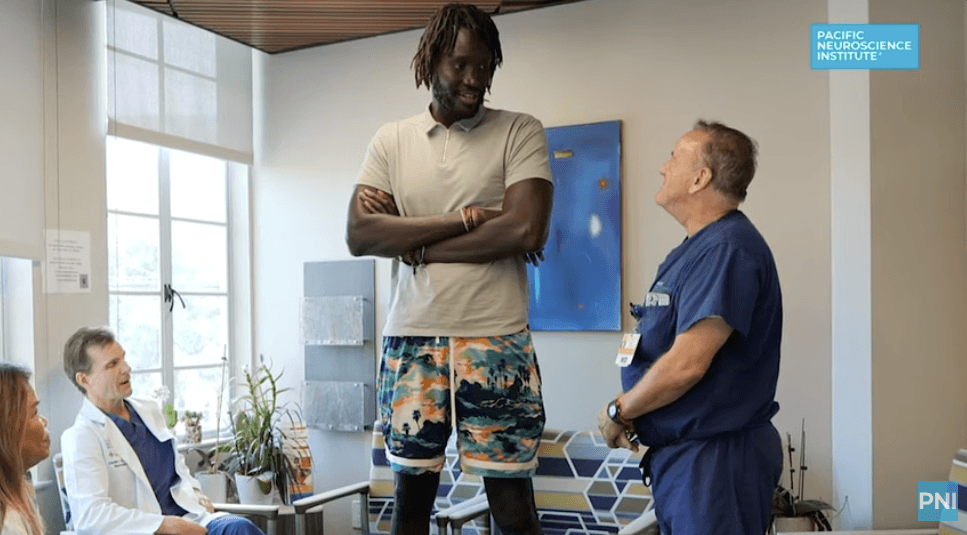 Mamadou standing with Dr. Griffiths