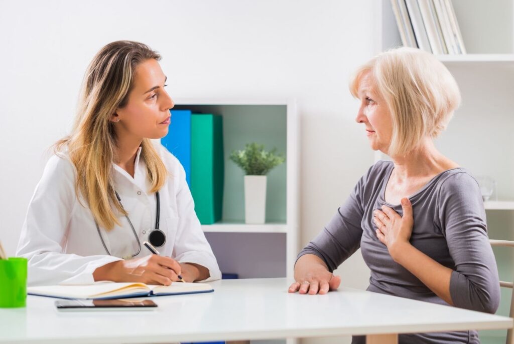 women doctor talking with women patient 