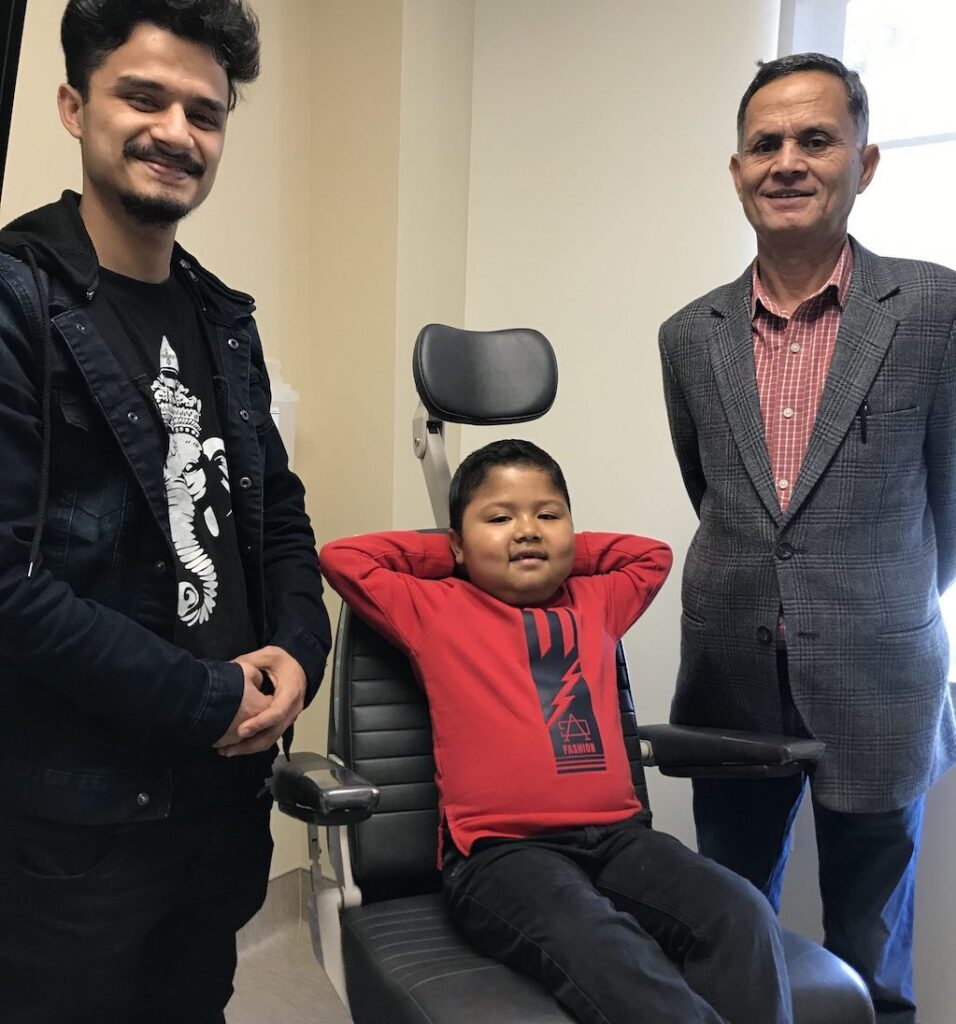 Basab with his brother and father before surgery