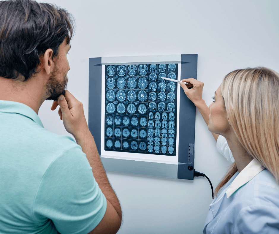 Female doctor and male patient look at brain scan at Pacific Neuroscience Institute.