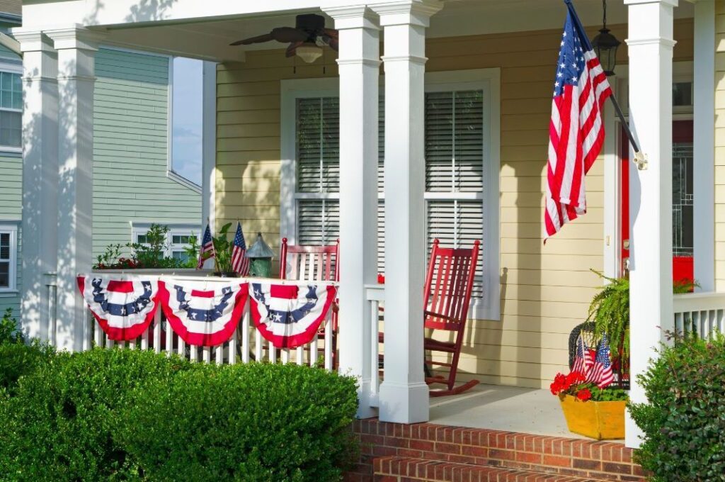 Front porch of a house decorated for the 4th of July.