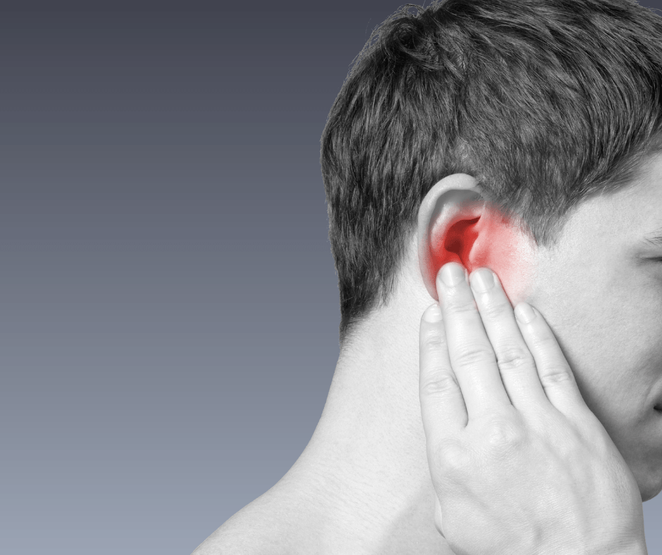 Black and white profile of person touching their ear. Ear is red to symbolize pain.