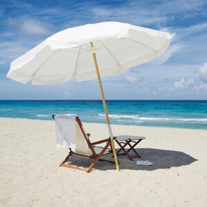 Beach chair and umbrella in the sand