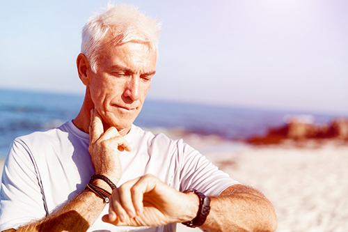 senior male checking his pulse