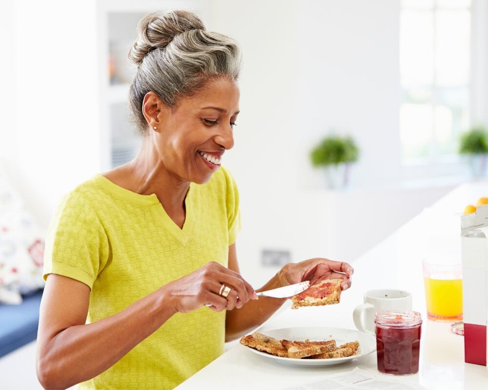 Senior woman eating for gut bacteria