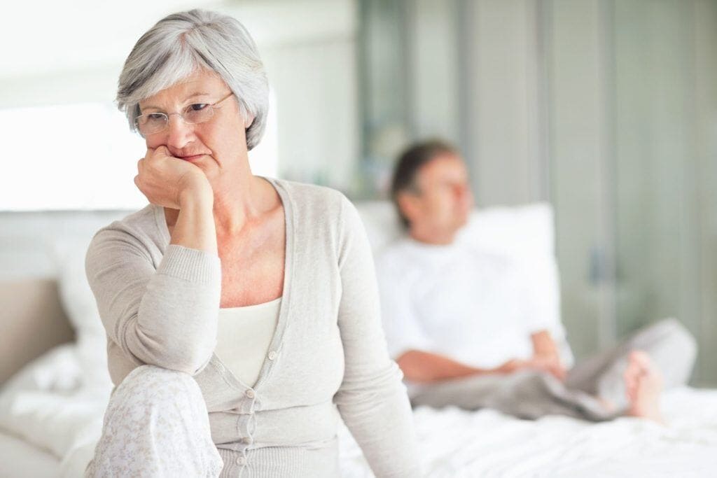 elderly woman deep in thought