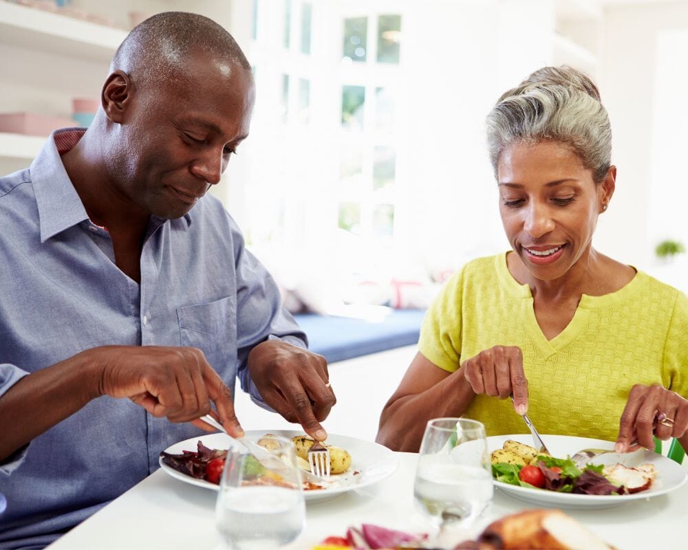Man and woman eating a meal together