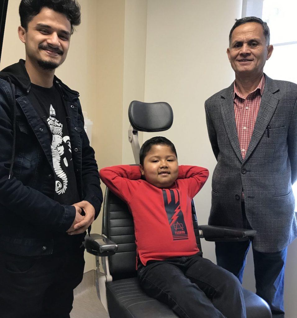Basab with his brother and father before surgery