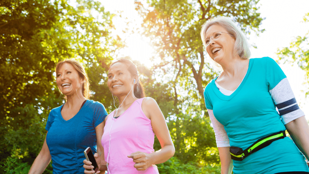 Three women walking outdoors for exercise