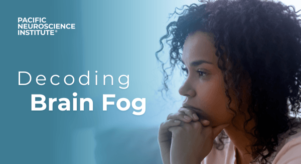 Blog feature image: A black woman with a focused expression, gazing into the distance with her chin gently resting on her hands. On the left, there is prominent text that reads 'Decoding Brain Fog'.