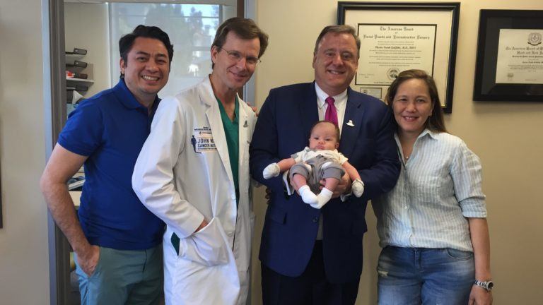 Daniel F. Kelly, MD & Chester F. Griffiths, MD, standing with their patients