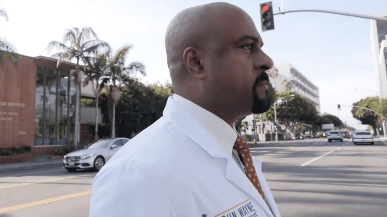Dr. Kesari standing in the street