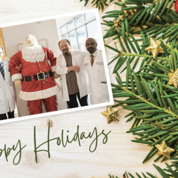 Santa and a group of PNI doctors in a snapshot