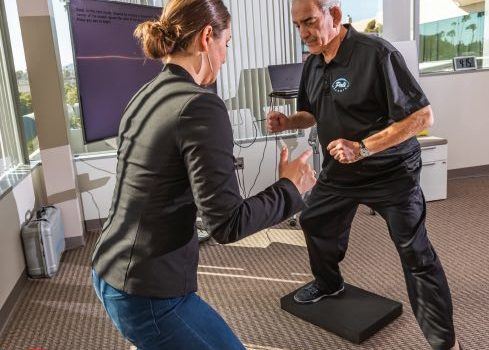 A man exercising at the CogFit program