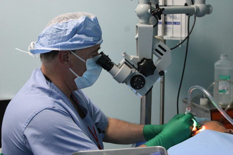 doctor performing a procedure on a patient