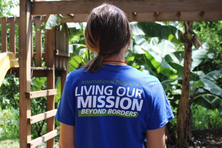 girl in a purple living our mission shirt