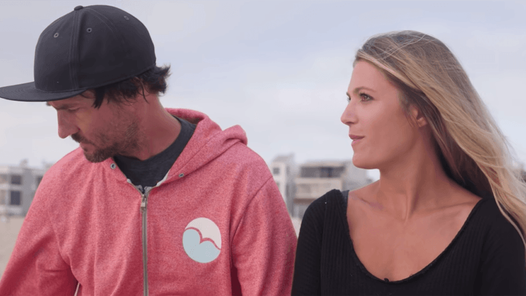 couple standing on a beach