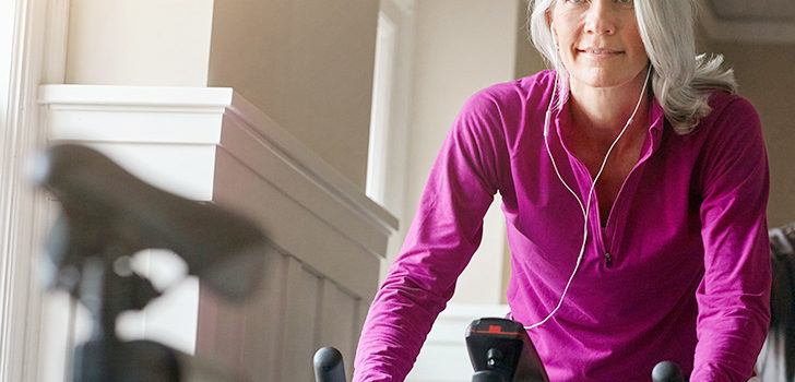 senior woman on an exercise bike