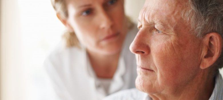 female nurse caring for an elderly patient