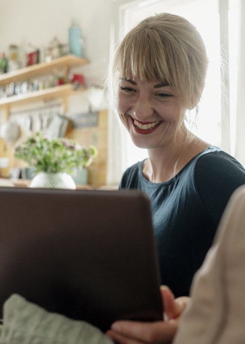 happy woman on her computer