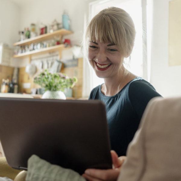 happy woman on her computer