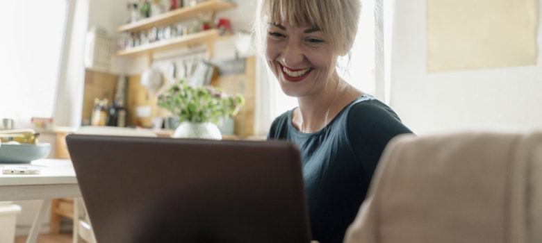 happy woman on her computer