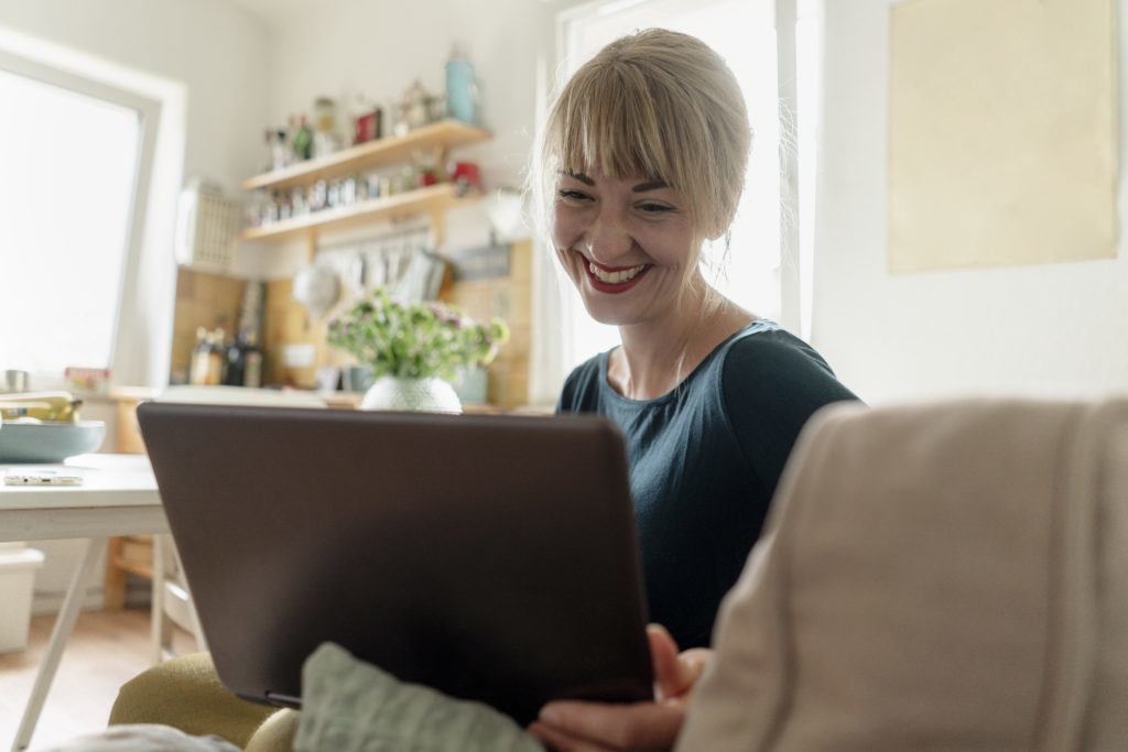 happy woman on her computer