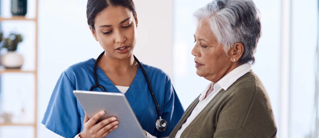 nurse speaking with her patient