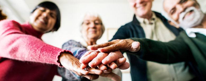 Seniors in a circle showing support