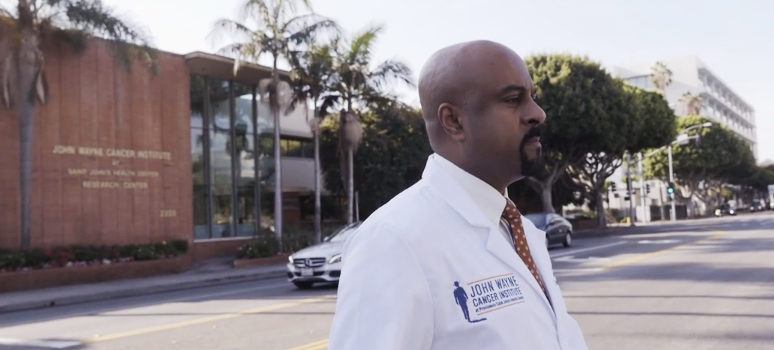 Dr. Santosh Kasari standing in a crosswalk