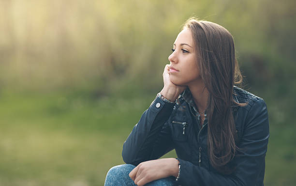 young woman looking thoughtful